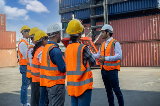 Safety topics for work: engineer talking to his team