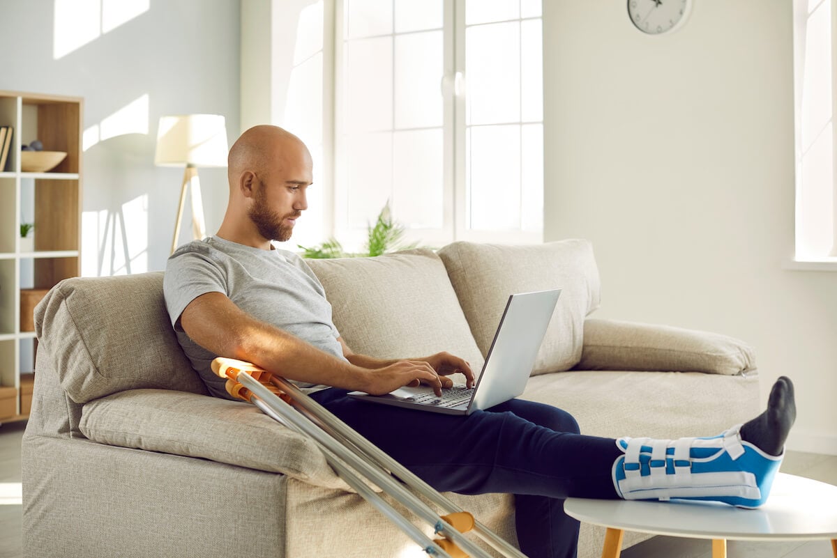 FMLA NY: man with a broken leg, working at home